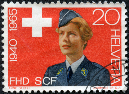 SWITZERLAND - CIRCA 1965  a stamp printed in the Switzerland shows Women s Army Auxiliary, 20th Anniversary of Women s Army Auxiliary Corps, circa 1965のeditorial素材