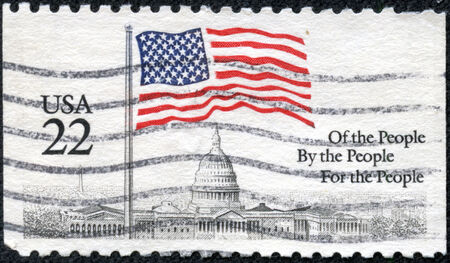 USA - CIRCA 1985: A stamp printed in the USA, shows a Flag over Capitol Dome, circa 1985のeditorial素材