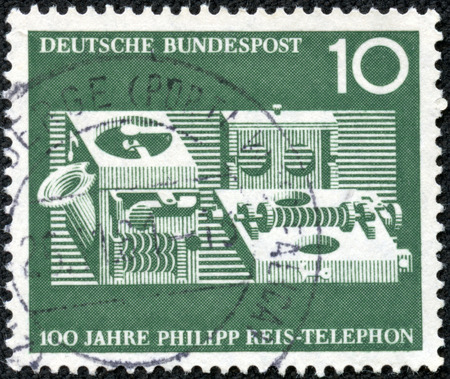 GERMANY - CIRCA 1961  a stamp printed in the Germany shows Reis Telephone, Centenary of the Demonstration of the 1st Telephone by Philipp Reis, circa 1961の写真素材