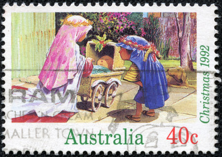 AUSTRALIA - CIRCA 1992  A stamp printed in the Australia shows Children Dressed as Mary and Joseph with Baby Carriage, Christmas, circa 1992のeditorial素材