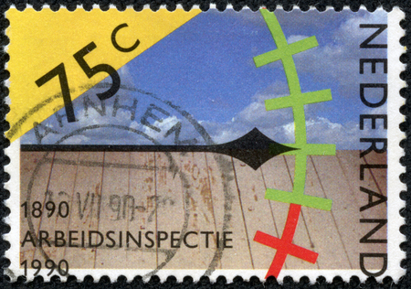 NETHERLANDS - CIRCA 1990  A stamp printed in Netherlands honoring Centenary of Labour Inspectorate, shows Pointer on Graduated Scale, circa 1990のeditorial素材