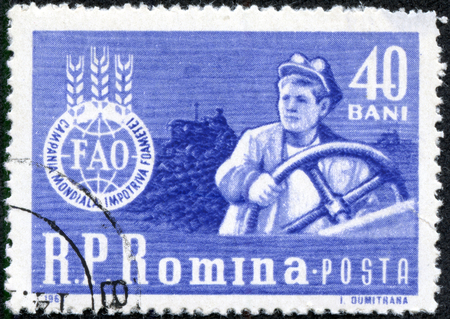 ROMANIA - CIRCA 1963  A stamp printed in Romania shows agricultural worker with the inscription  FAO - Global campaign against hunger  from the series  Global campaign against hunger , circa 1963のeditorial素材