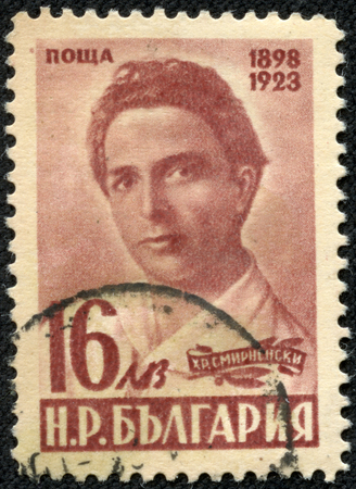 BULGARIA- CIRCA 1948  A stamp printed in Bulgaria shows proletarian portrait of poet Christo Smirnenski  1898-1923 , founder of socialist realism in the Bulgarian literature, circa 1948のeditorial素材