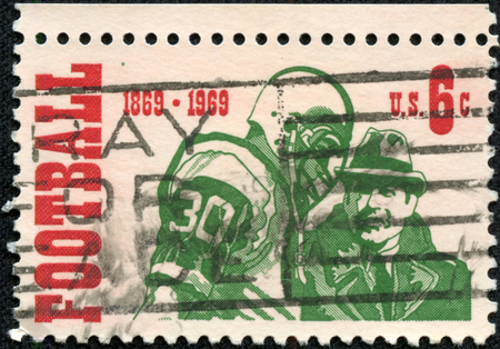 UNITED STATES - CIRCA 1969  a postage stamp printed in USA showing commemorative of the centenary of the first intercollegiate football game, circa 1969 のeditorial素材