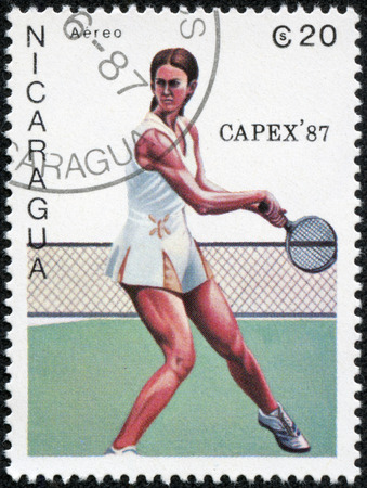 NICARAGUA - CIRCA 1987  A stamp printed in Nicaragua shows a tennis player, circa 1987のeditorial素材