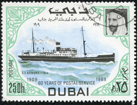 DUBAI - CIRCA 1969   A stamp printed in Dubai shows ship, circa 1969のeditorial素材