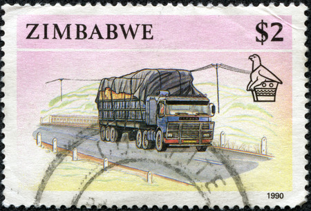 ZIMBABWE - CIRCA 1990  A stamp printed in Zimbabwe shows image of a goods lorry, series, circa 1990のeditorial素材