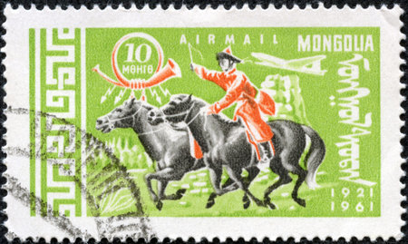 MONGOLIA - CIRCA 1961  stamp printed in Mongolia, shows Mongolian rider on horse, series, circa 1961のeditorial素材