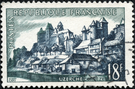 FRANCE - CIRCA 1956  A stamp printed by FRANCE shows view of Uzerche town in the Correze department - The Vezere river, the Castle, and the Abbey Church, circa 1956 のeditorial素材