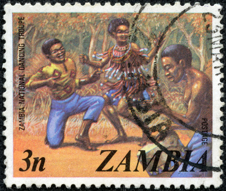 ZAMBIA - CIRCA 1980s: A stamp printed in the Zambia shows dancers of the national dance troupeA stamp , circa 1980s.のeditorial素材