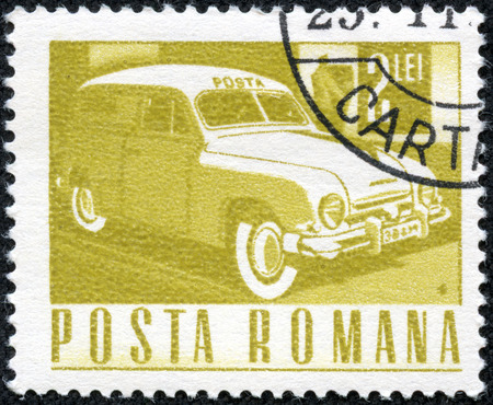 ROMANIA - CIRCA 1968: A stamp printed in the Romania shows Mail truck, circa 1968のeditorial素材