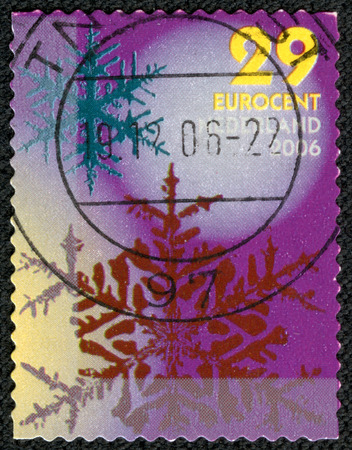 NETHERLANDS - CIRCA 2006: stamp printed by Netherlands, shows Snowflakes, Large pink, small red flakes, circa 2006の写真素材