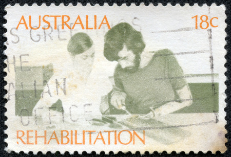 AUSTRALIA - CIRCA 1972: a stamp printed in the Australia shows Amputee Assembling Electrical Circuit, Rehabilitation of the Handicapped, circa 1972のeditorial素材