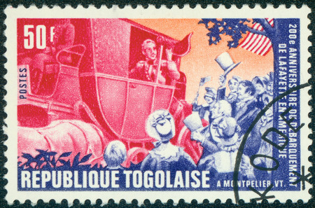 TOGO - CIRCA 1977: A stamp printed by Togo, shows Lafayette arriving in Montpelier, circa 1977のeditorial素材
