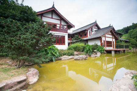 traditional chinese building by the lake,chongqing,chinaのeditorial素材