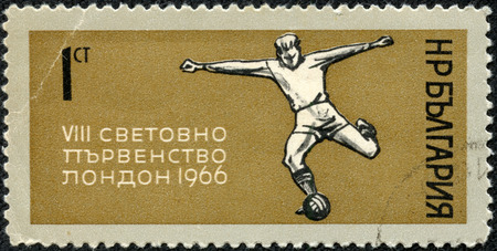CHONGQING, CHINA - May 10, 2014:A stamp printed in Bulgaria shows football player kicks the ball, dedicated to the World Cup in London in 1966, circa 1966のeditorial素材