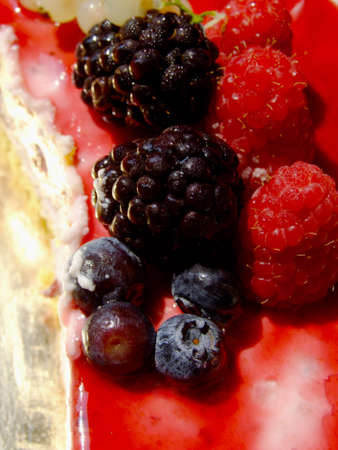 Cheesecake with berries and raspberry sauceの写真素材