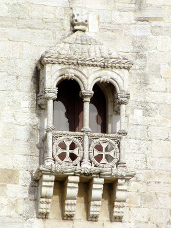 Detail of the balcony of Belém tower on river Tagus in Lisbon. It is considered one of the main works of the Portuguese late gothic and it is decorated with the typical manueline motifs like the armillary sphere (symbol of king Manuel I) and the cross of の写真素材