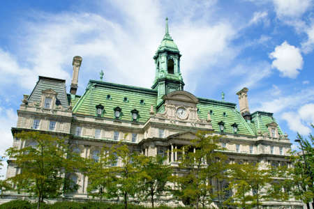The old Montreal city hall (hotel de ville) on a cloudy dayの写真素材