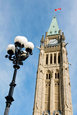 Tower of the Parliament of Canada in Ottawa and streetlamp in the early morning lightの写真素材