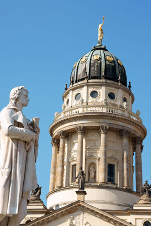Detail of the French Dome and the statue of german poet Friedrich Schiller in Gendarmenmarkt Square in Berlin. の写真素材