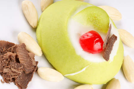 Close-up of a mini sicilian cassata with pieces of candied fruit, chocolate and almondsの写真素材