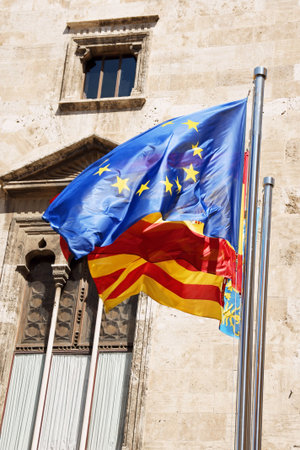 European Union, Spain and Valencia flags in front of Palau de la Generalitat in Valencia, Spain.の写真素材
