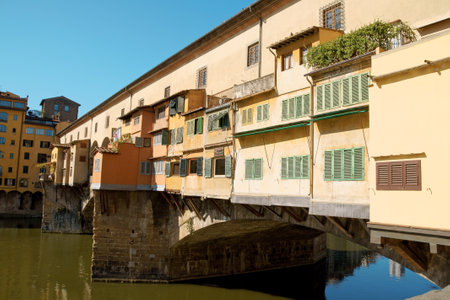 Ponte Vecchio (old bridge) on river Arno in Florence. This medieval stone arch bridge is very well known for its jewellers shops constructed on it.のeditorial素材