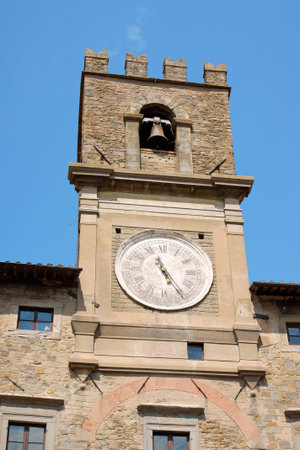 Detail of the 13th century clock tower of Cortona Town Hall in province of Arezzo, Tuscany, Italy.のeditorial素材