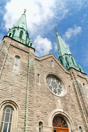 Facade of Sainte Cecile Church in Montreal on a cloudy dayの写真素材