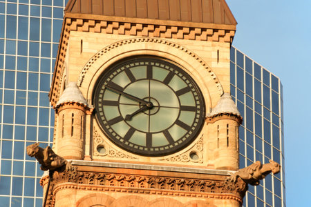 Detail of the clock tower of Toronto Old City Hall in the sunset light.