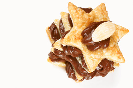 Star shaped chocolate cream and almond millefeuille over a white background, with copy space. Selective focus.の写真素材