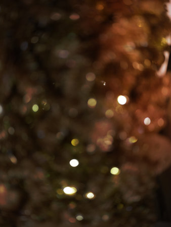 Christmas and Happy new year on blurred bokeh christmas tree . Golden tone . SPACE FOR TEXTの写真素材