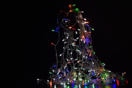 Colorful led lights on black background for festival. Christmas. New year. Wallpaper.の写真素材