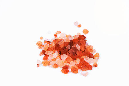 Himalayan pink rock salt on white background. Background of salt crystals.の写真素材