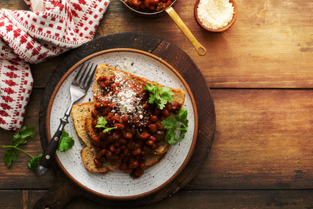 Baked beans with bacon on a toast with cotija cheeseの写真素材