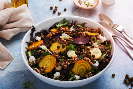 Beet salad with red and yellow beets with lemon dressing and crunchy roasted chickpeasの写真素材