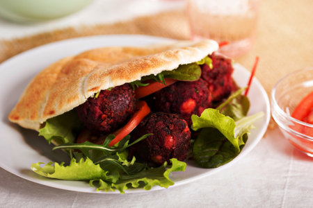 Beetroot falafel served with salad in a pitaの写真素材