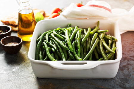 Blanched green beans in a baking dish, healthy side dishの写真素材
