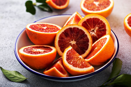 Blood oranges cut into half, juicy winter citrusの写真素材