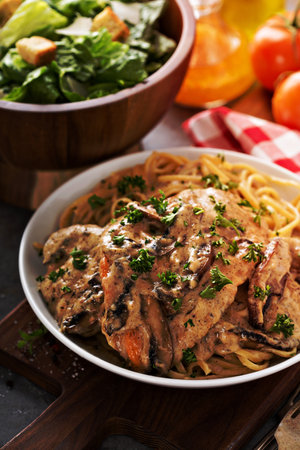 Chicken marsala with mashrooms and linguine pastaの写真素材