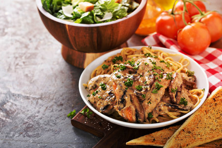 Chicken marsala with mashrooms and linguine pastaの写真素材