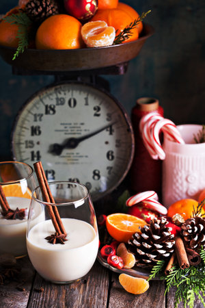Eggnog with cinnamon for Christmas in a rustic settingの写真素材