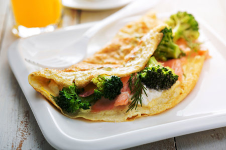 Egg-white breakfast omelet with salmon and broccoliの写真素材