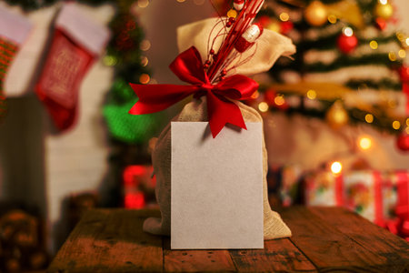 Blank postcard with decorative Christmas elements in the background. Christmas card mockup.の写真素材