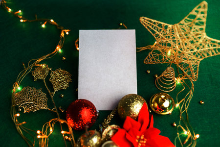 Blank card with Christmas decorations and poinsettia. Christmas card mockup.の写真素材