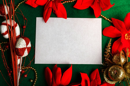 Blank card with Christmas decorations and poinsettia. Christmas card mockup.の写真素材