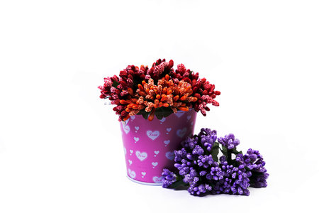 aluminum ice bucket laid in wait for use. stainless multi-colored buckets with reflection, white background isolated, with green blue flowersの写真素材