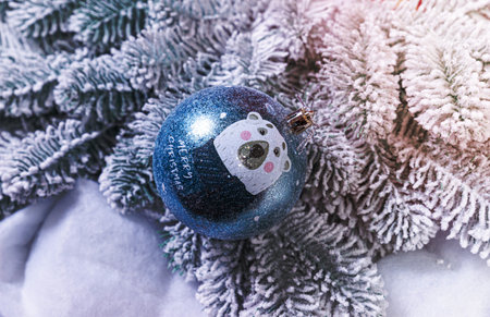 Creative diy craft hobby. Making handmade craft christmas ornaments and balls with felt spruce tree. christmas tree with colorful balls and gift boxes over white brick wall with blue and white ballsの写真素材