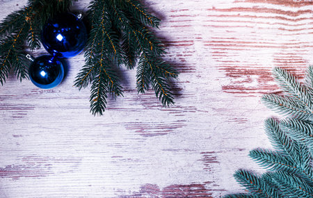 Flat lay composition with serpentine streamers and Christmas decor on wooden background. Space for text Balls, branches, hat, presentsの写真素材